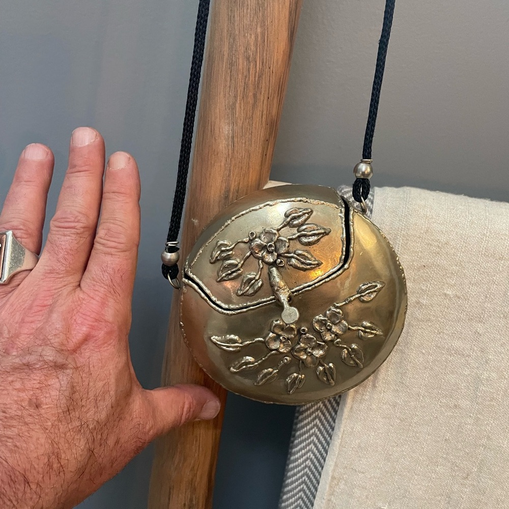 Metal hinged small round purse w floral markings